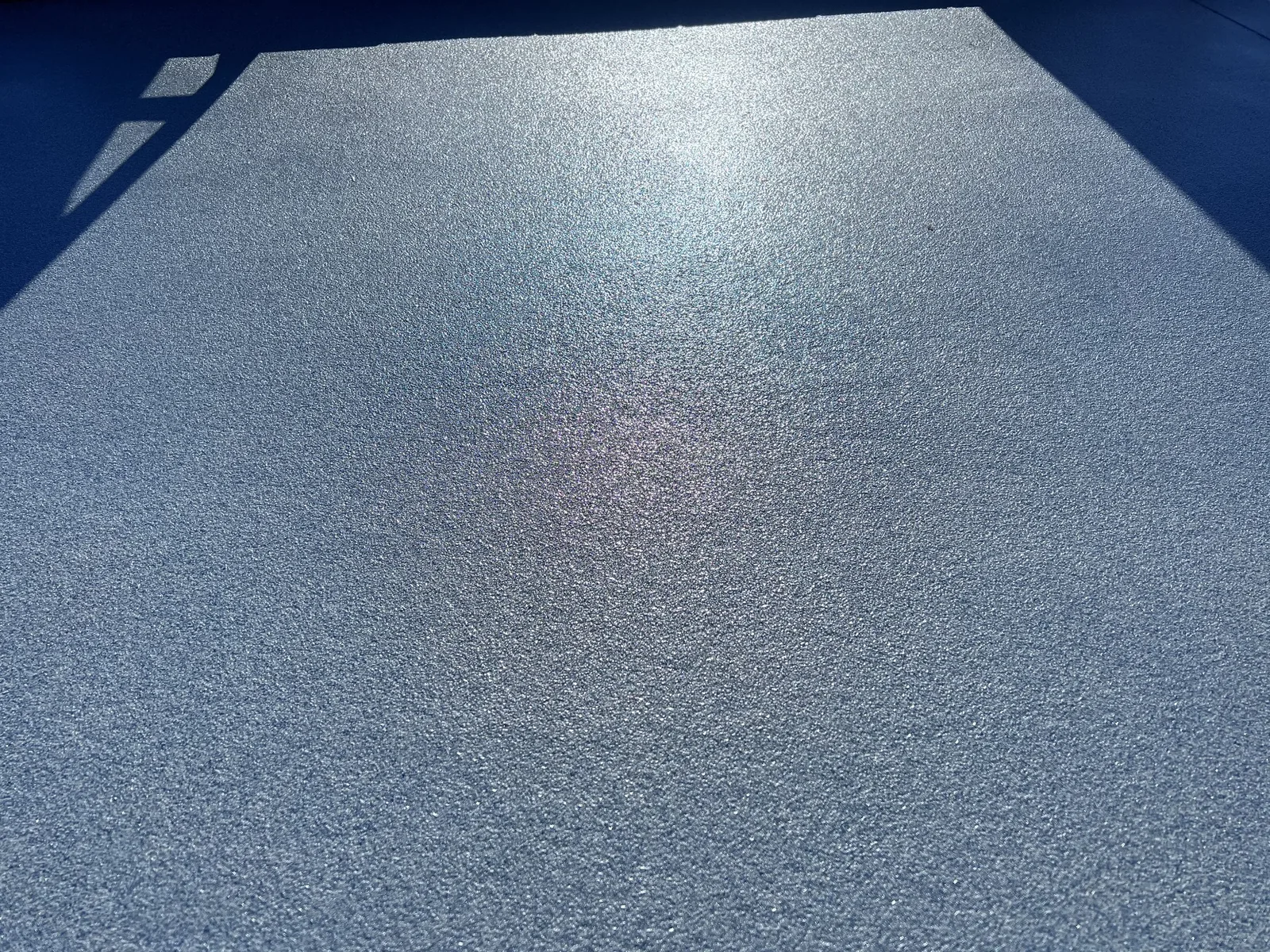 Close-up of a grey speckled floor finish